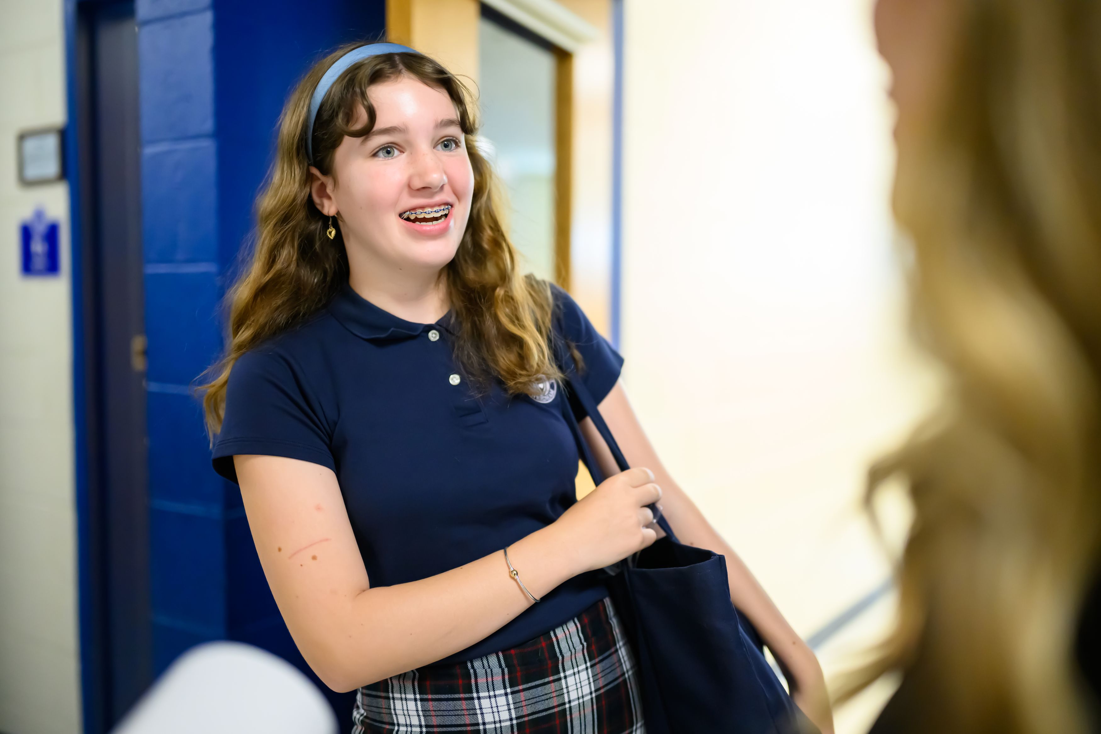 Upper School student at her locker