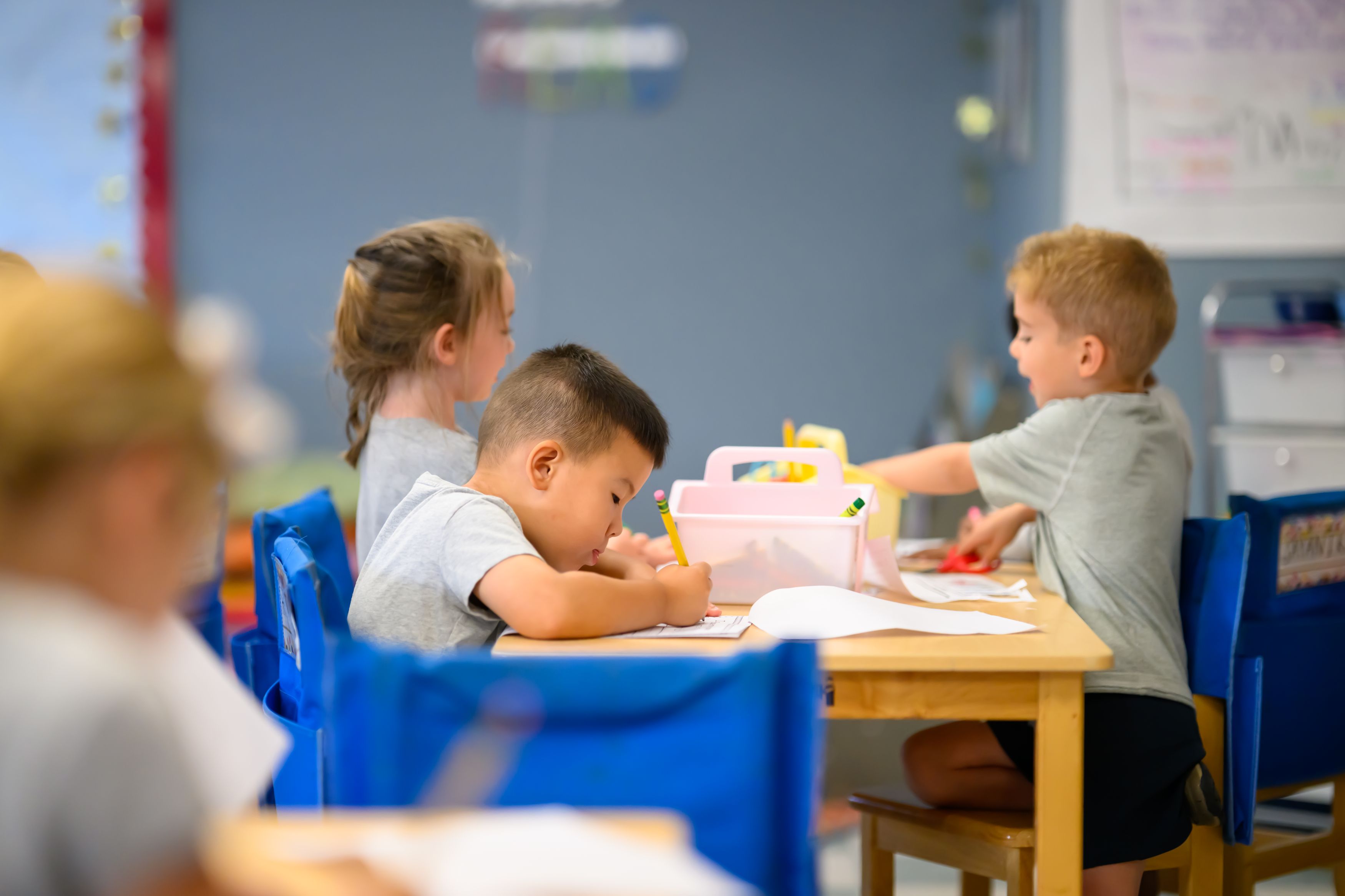 Early Childhood students drawing at a table